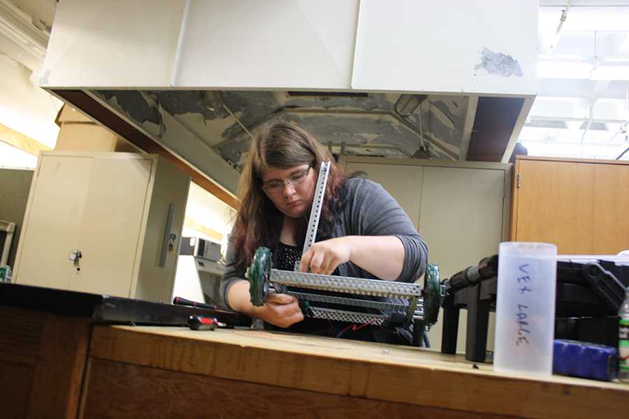 Senior Onika Martin works on her teams robot for the Oct. 24 contest.