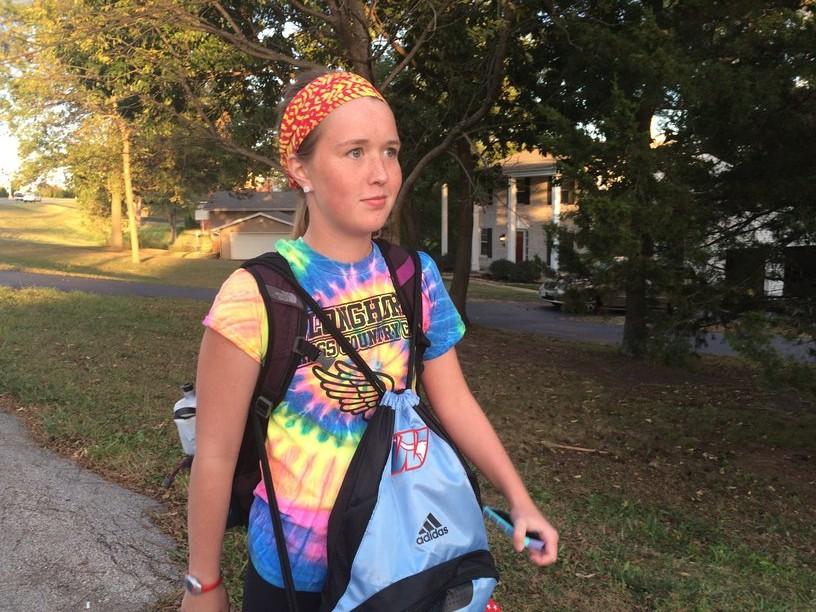 Sophomore cross country runner Jane Fuller walks home with the new girls cross country backpack, which features the redesigned W longhorn logo.