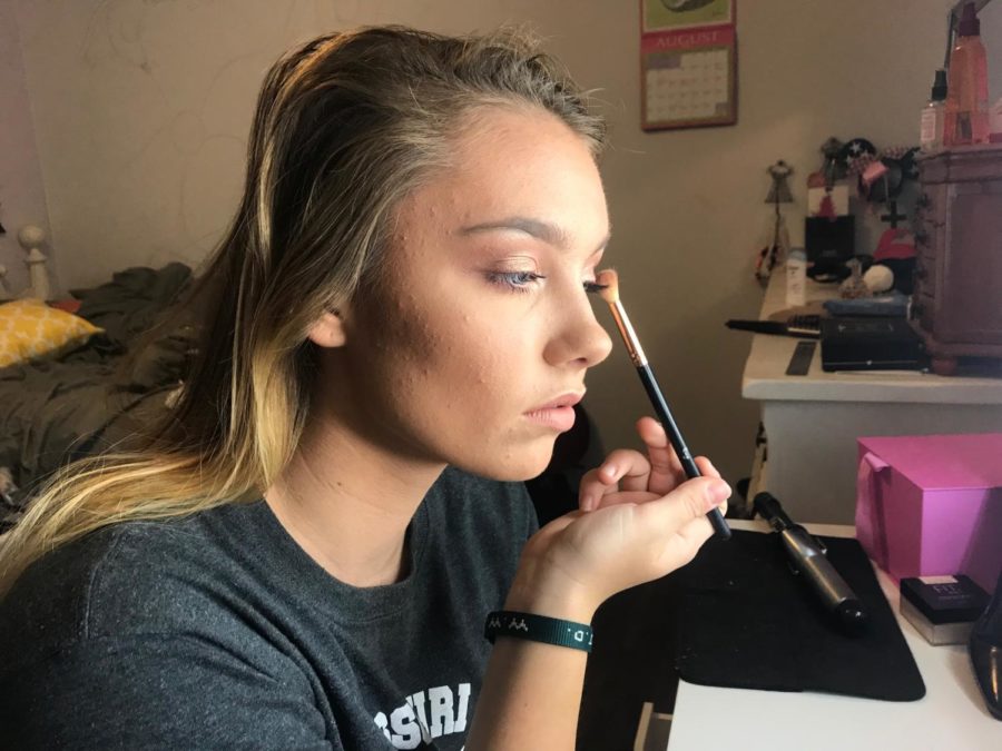 Applying eye shadow, senior Bailey Goughenour completes a makeup look. Goughenour started her makeup Instagram and YouTube accounts this summer in order to further her hobby and do more freelance makeup. “As of right now, I’d say my Instagram account is what I’m most proud of because I put a lot of effort into it, and it’s really satisfying to see people following me, commenting or direct messaging me asking if I can do their makeup,” Goughenour said.