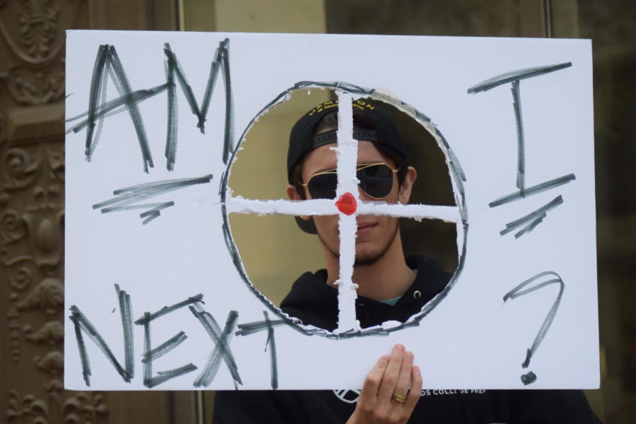 On the anniversary of the Columbine High School shooting, April 20, 2018, a student holds a sign at a protest against gun violence in downtown St. Louis.