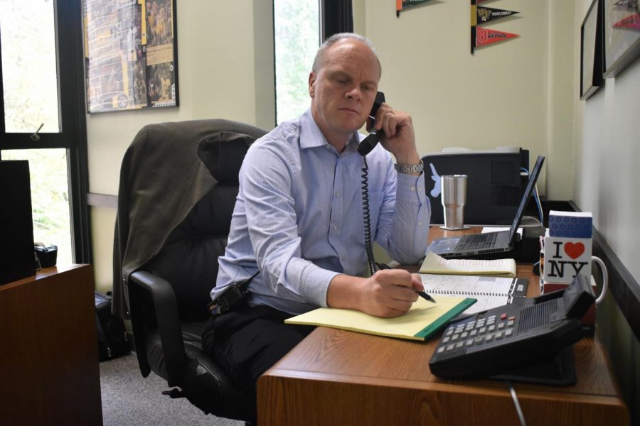 Sitting at his desk, Principal Jeremy Mitchell takes a call from a parent. During the summer, administrators got together to discuss changes that needed to be made. “There is still discipline enacted because you are still breaking a school expectation,” Mitchell said. “It’s just that the type of discipline will be one that will not only be disciplinary action but disciplinary action with a purpose.”
