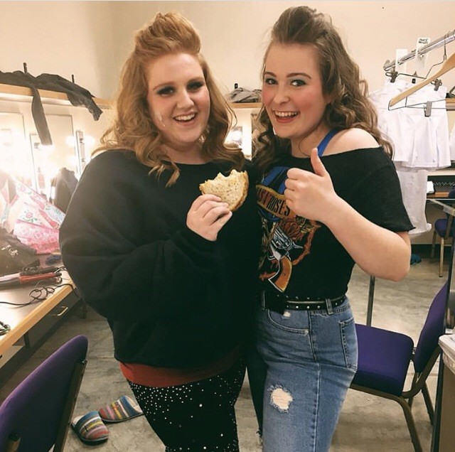 Preparing to go on stage for CBC’s performance of “Rock of Ages,” seniors Sophie Reidt and Cat Hercules pose for a picture. Reidt and Hercules played waitresses and decided to pose with a sandwich Reidt was eating at the time. “I was just eating in the dressing room and we aren’t supposed to do that, so when we took our picture it was to be funny,” Reidt said.