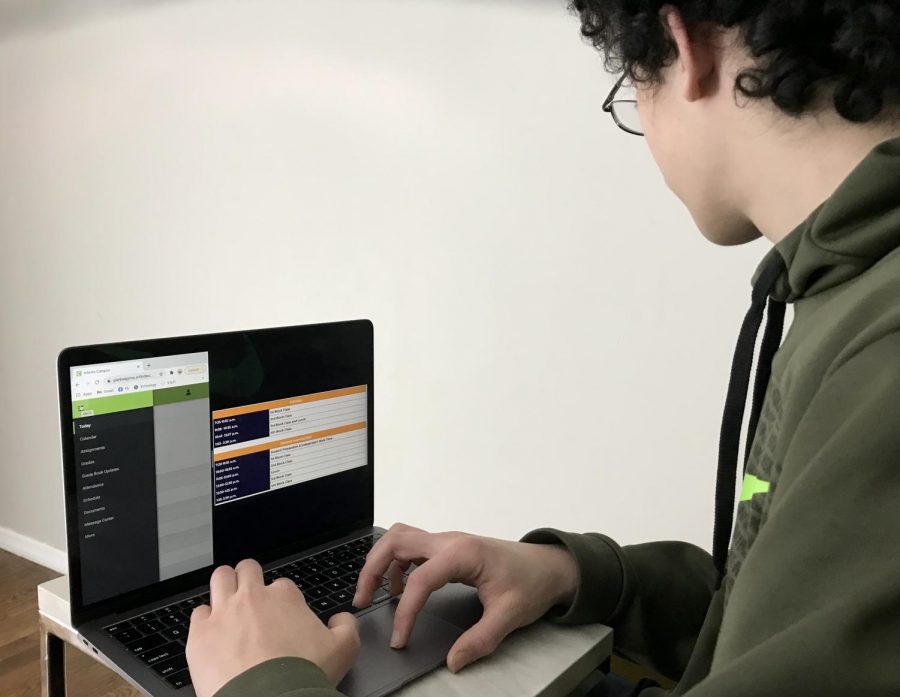A Virtual Campus High student checks his schedule on Infinite Campus in preparation for class. 
