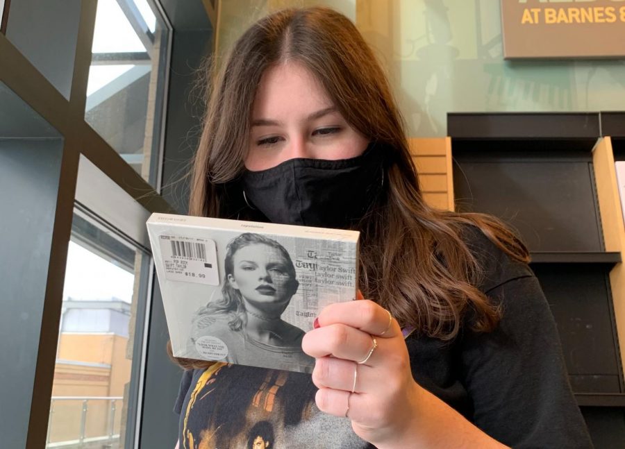 On a trip to the mall, freshman Natalie Lashly views the track list to Taylor Swift’s sixth studio album “Reputation.” In its first week, the album sold over 1 million physical copies, the only one to do so in 2017. “When the re-recordings are out and I walk into a store and see the CDs or Vinyls of them, it’ll be rewarding to know people are buying music that’s permanently hers,” Lashly said. 