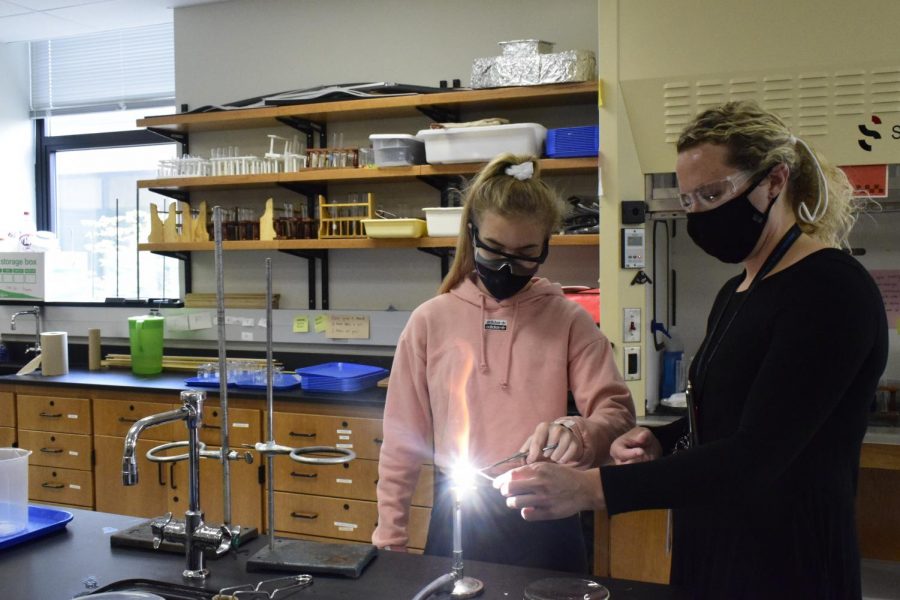 Junior Graci Badami completes a lab in Chemistry alongside science teacher Allison Privitt.