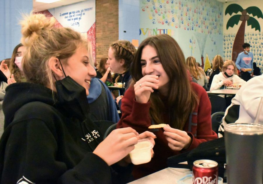 Freshman Skyler Gulino and freshman Molly Bailey converse and laugh at their second lunch. Now that she has been in person for three months, Bailey is feeling more a part of West than she did last year. “In eighth grade, I was [a part of] the virtual Parkway West (middle school campus) program. I hadn’t actually and physically been in person since about November of 2019, my seventh grade [year],” Bailey said.
