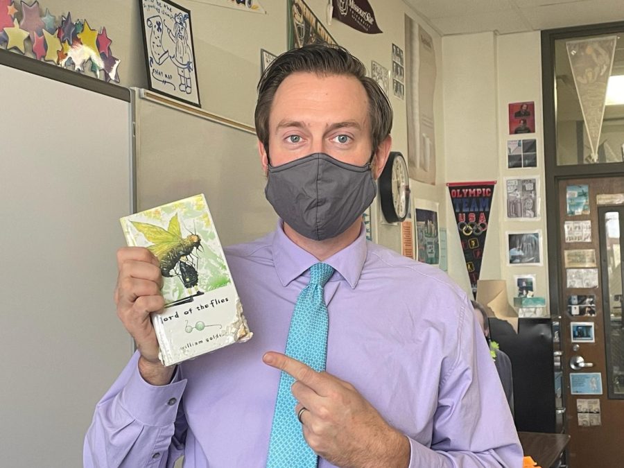 English teacher Dan Barnes points to a book that was eaten by his student’s dog.