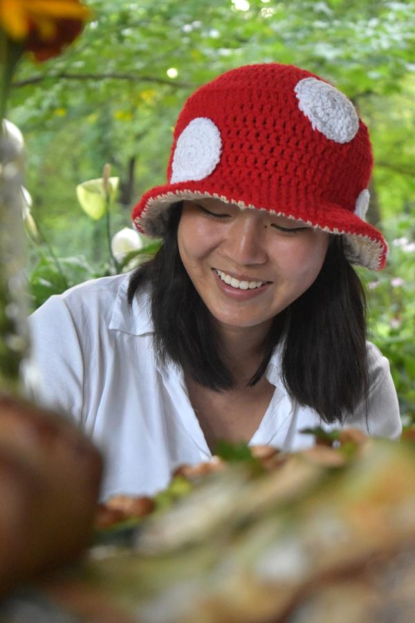 Senior Marissa Liu embraces the fairy tea party theme by wearing a mushroom-inspired hat. Liu created the hat using materials she found around her house. “Use the resources you have [when preparing for themed events],” Liu said. “You dont really have to go out and buy a lot of things, you can just try and put [an outfit] together [from what you already have].”