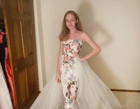 Posing in her last pageant dress, sophomore Romy Taylor reminisces on her past competitions. Taylor has participated in pageants for seven years.“[The most rewarding thing about pageants] are the relationships you make. Because whether or not you win, youre always going to make friends,” Taylor said. 