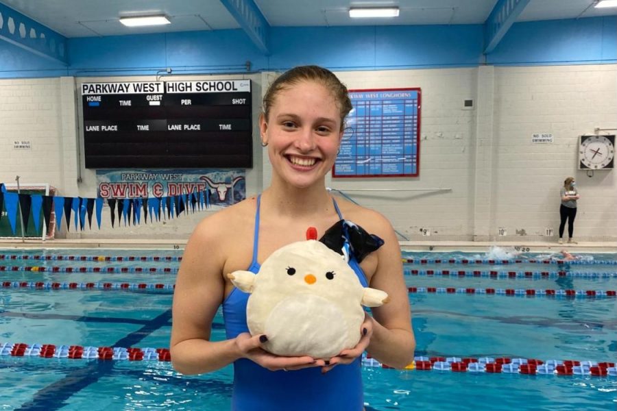 Junior Campbell Murawski prepares for her second meet of the new year. Murawski brought in her stuffed animal good luck charm, Good-Luck Chicken, for the meet against Nerinx Hall High School. “Since it was finals week, and the team was down nine swimmers, I thought it would be a good idea to bring in Good-Luck Chicken to lift the teams spirit. But, most importantly, remind everyone to have fun and take advantage of a home meet,” Murawski said.