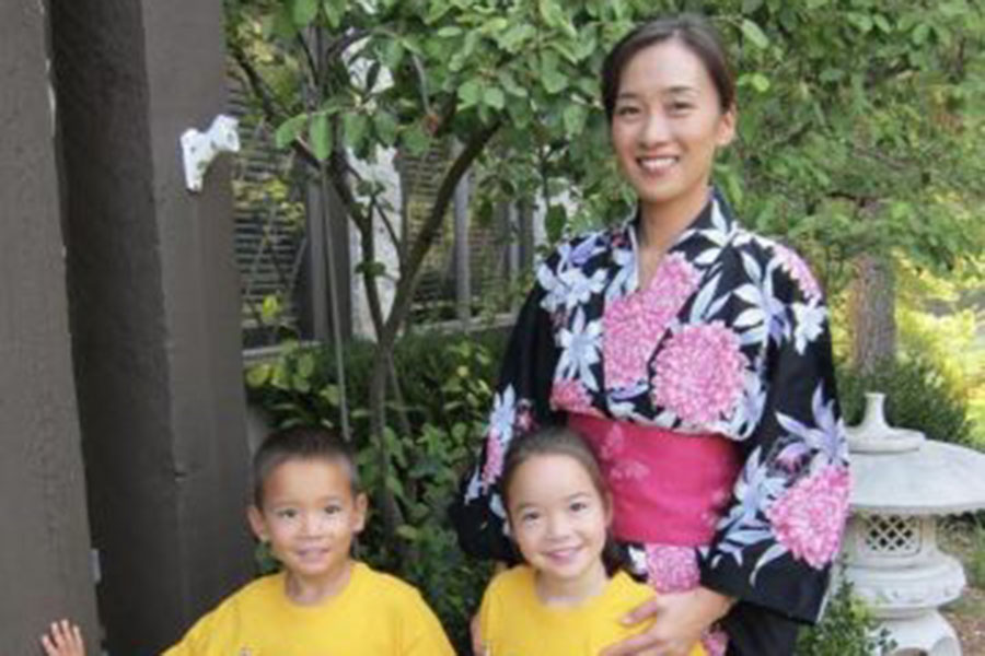 Sophomore Jade Senseney poses with her brother, sophomore Kayden Senseney and her mother, before attending the Missouri Botanical Gardens Japanese festival. Senseney’s mother wears a Yukata [a traditional summer kimono] as Senseney and her brother wear their Japanese school shirts. “One thing that brings me joy about my heritage and culture is going back to Japan and taking in how others’ lives are, how my grandparents live and understanding their way of life and what’s important to them,” Senseney said.