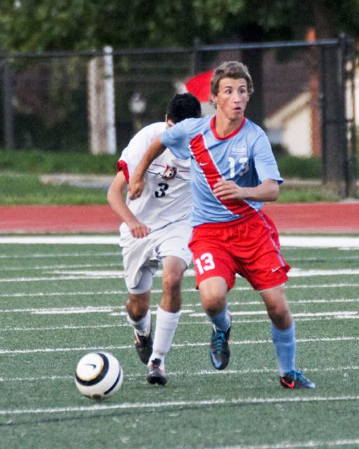 Dribbling the ball down the field, junior Gavyn Prsha looks for a teammate to make a pass. 