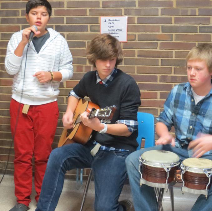 The morning of Friday, Dec. 14, the Fallen Kings play for a crowd at the top of the main stair well. The guitarist of the band, freshman Jacob Cupps played the song I’m Yours, by Jason Mraz. “It’s a nice song and fairly easy. A lot of people know it, so it works out really well,” Cupps said.