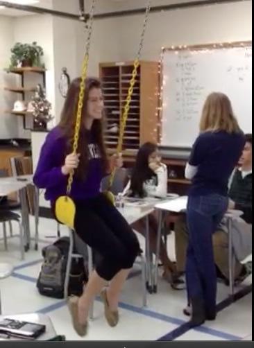 Senior Paige Smith enjoys swinging near the end of class seventh hour in Ellen Wilke’s classroom. 