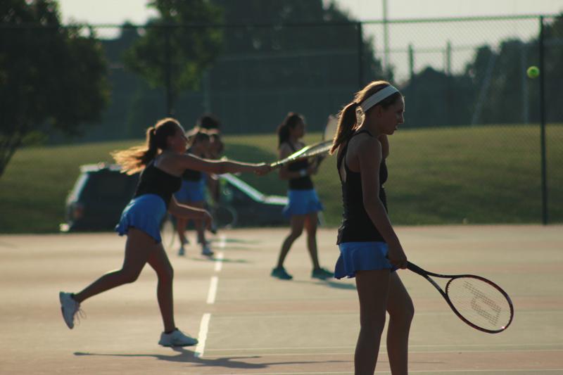 The+girls+tennis+team+takes+the+courts+Fri.+Aug.+23+at+Red+and+Blue+Night.+The+team+had+been+practicing+for+two+weeks+prior+to+the+event.+I+am+really+looking+forward+to+team+bonding+this+year%2C+Quoss+said.