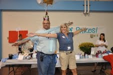 Building Manager Scott Bollmann and co-chair Linda Gieseking  promote the raffle ticket wingspan sale. 