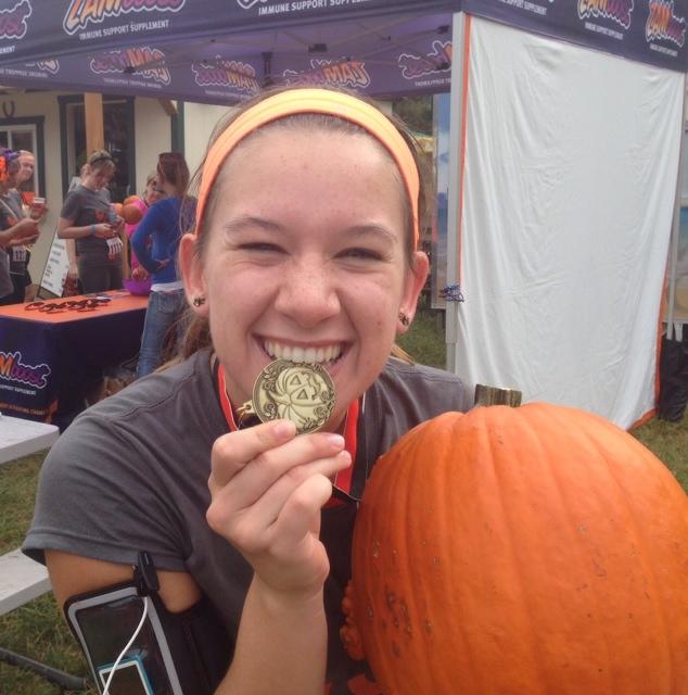 Sophomore Emily Wind after the Pumpkin Run. She had to run the 5K through a corn maze while holding a twelve pound pumpkin.  “While I am running I just think to myself that there are women giving birth right now and all I have to do is run. Also, don’t eat a lot before you run; that is never a good idea,” Wind said.