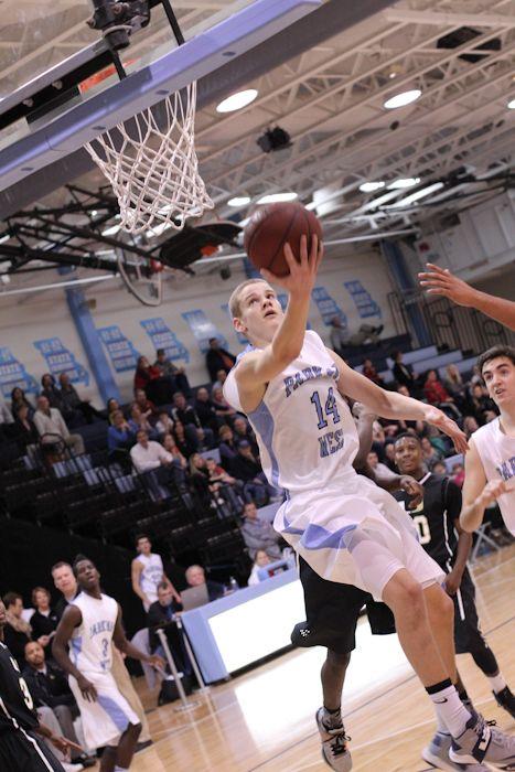 Senior Guard Jake Socha makes a layup against U-City last year. Socha hopes to improve off of his standout junior year. 