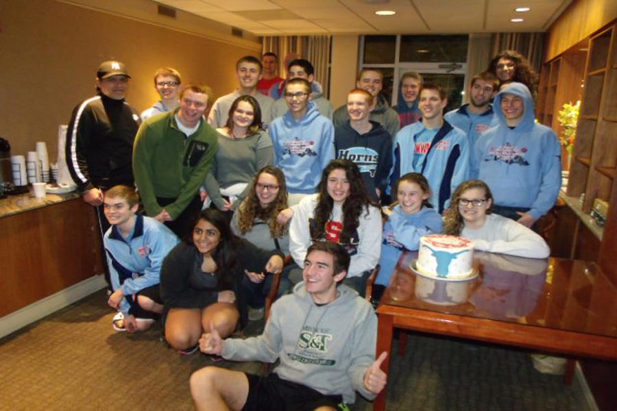 The racquetball team gathered in the Park Lane Suites lobby for senior Emily Karandzieffs surprise 18th birthday party. The team gathered in the lobby to celebrate the day of their arrival, kicking off the tournament in a festive way. 