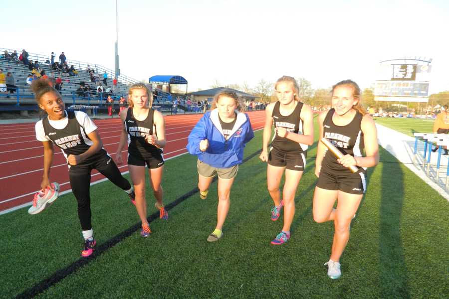 The varsity girls track distance medley is cooling down after breaking the record at the annual Washington Relay meet. The team consists of junior Maddy Brown, sophomore Abby Allgeyer, sophomore Rachel Osborne and freshman Rikita Saunders and also pictured is sophomore Lindsey Stucki. “It was a pretty big deal because we tried to break the records in other events but missed it by one or two seconds each so it was nice to end on that note. It was a great meet; I loved it” Allgeyer said. 