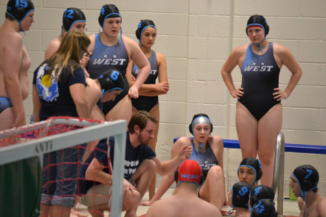 JV water polo huddles around coach Brian Welch discussing plays on April 26. 