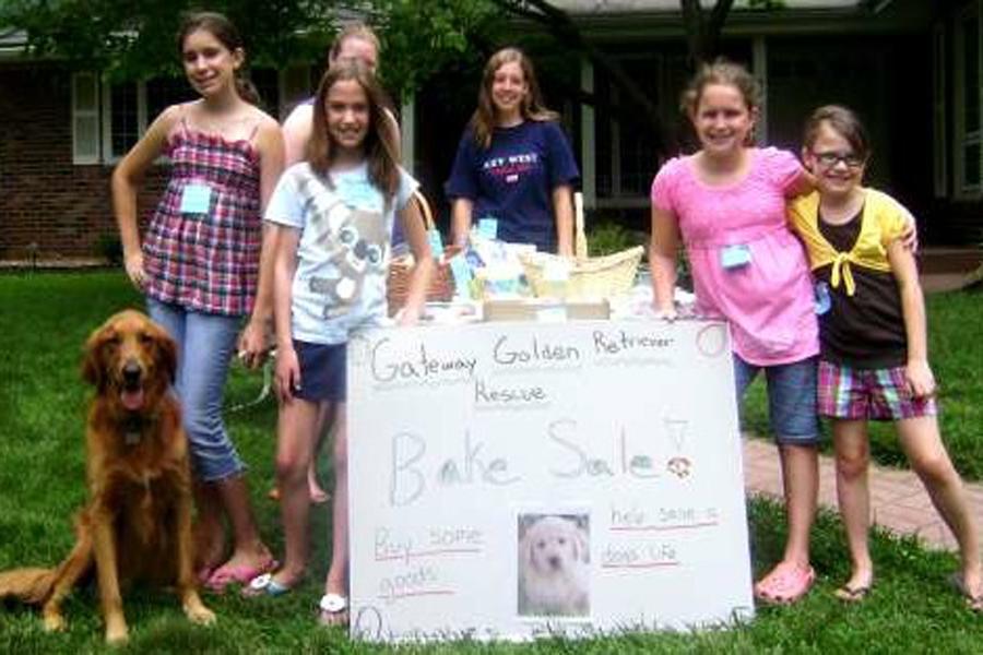 Egan (second from right) at age 10 raised $126 during her first year at the bake sale.  