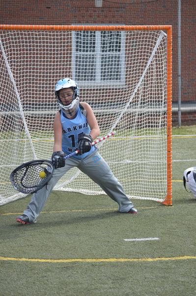 Sophomore Tabatha Saake saves a goal during the varsity lacrosse game. Saake is being awarded the 1st Team All Conference award for the position of goalie. “When I started playing last year as a freshman, I fell in love with the sport. One of my favorite things about lacrosse is bonding with my teammates through our love of lacrosse and the hard work we all put out,” Saake said. 