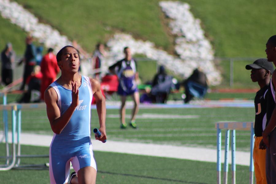 Freshman Nehemiah Colyer sprints at a boys track on the track. Colyer ran the 4x4 and the 300 meter hurdles this season. “I would say my biggest accomplishments are actually being able to run on varsity since not many freshman are actually able to do that. It feels pretty cool and kids stop me in the hallway and ask me about it but I try not to make a big deal about it and stay humble,” Colyer said. “I ran track because I want to stay in shape and to get faster for football.”
