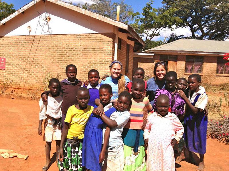 Junior Gwenn Pietrowski and her sister Erin travel to Embangweni, Malawi with family. 