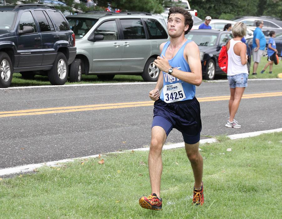 Senior captain Philip Aden wears the columbia blue varsity jersey as he races in the Randy Seagrisk invitational