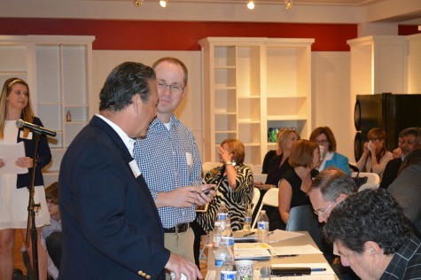 The panel of judges meets before the beginning of the session.