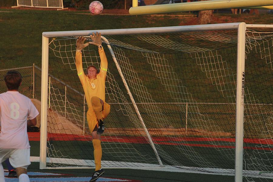 Sophomore Andrew Engelmeyer saves a goal against Ladue to send the game to penalty kicks