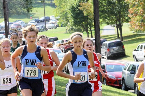 Maddy Brown and Natalie Rath run in the Hancock Invitational on September 27.