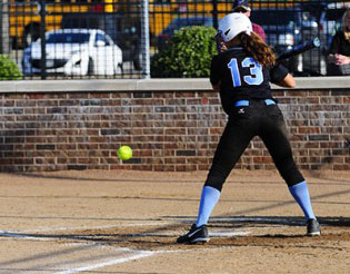 Junior Grace Gwin swings at the ball.