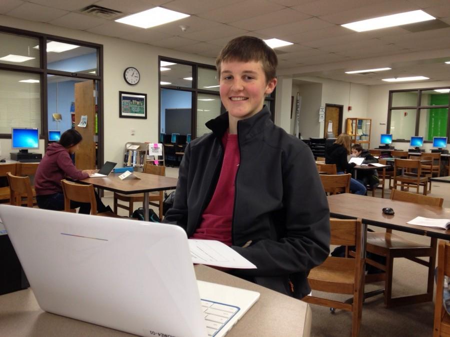 Working+on+a+research+project%2C+freshman+Joe+Roseman+uses+a+Chromebook+in+the+library.+