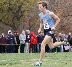 Finishing 18th individually, Andrew Osborne runs the last 50 meters of the 5K race.