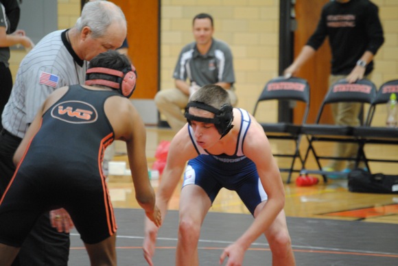 Sophomore Mike Butler, facing a Webster Groves opponent in a match last season. 