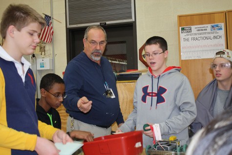 Cliff Amen directs students in the Robotics class. Amen also teaches Construction Tech, Honors Intro to Engineering Design and Honors Principles of Engineering. "We get to work with our hands and actively do a lot of stuff, which really helps me," junior Grace Gwin said.