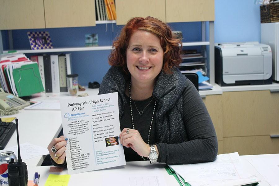 Freshman principal Kate Piffel poses with the flyer for the AP Fair. The AP Fair will be taking place on Wed., Jan. 14 during the Common Ground. “It’s going to be in the cafeteria and essentially, with this being the first year, we are kind of playing it by ear but we are going to set up tables all around the room and have kids walk around. It’s going to be very much like a career or college fair atmosphere,” Piffel said. 
