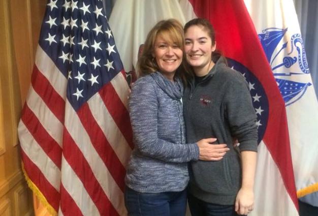 Senior Kate Sullivan stands with her mom Roxanne after being sworn into the military at the Military Entrance Processing Station (MEPS) building on Dec. 11.