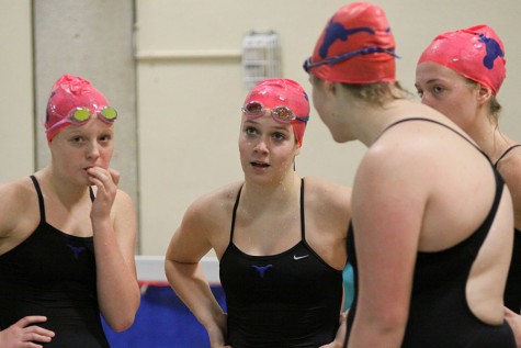 Freshman Jessica Schlueter stands at a girls varsity swim meet. The meet was held at Parkway North High School on Dec. 19. 