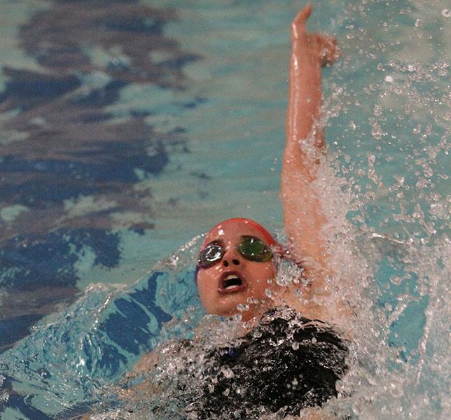 Junior Kristen Petersen swimming the backstroke on Dec. 19. The meet was held at Parkway North High School. 