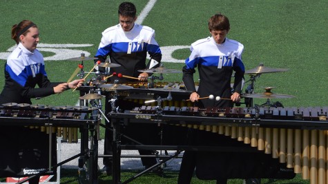 As a part of the band family, juniors Allison Wills, Matt Soehngen and sophomore Jacob Mueller practice their instruments. Most of my closest friends I met through band, Wills said. Without it, I probably wouldnt even know some of them.