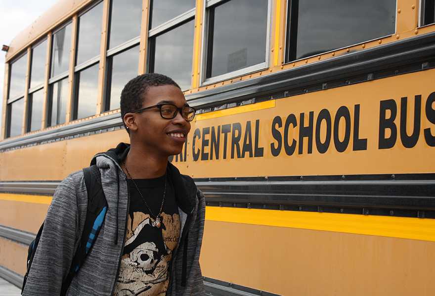 Freshman Chris Bass prepares to board his afternoon bus for a 40 minute trip to his home in St. Louis city. 