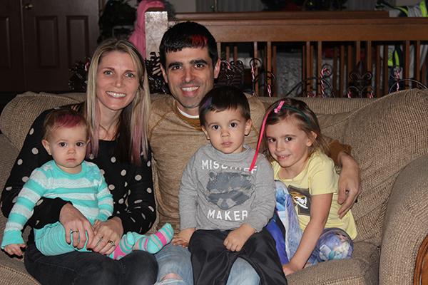 Junior Assistant Principal, Mario Pupillo sits with his pink-haired family in support of his mother-in-law.