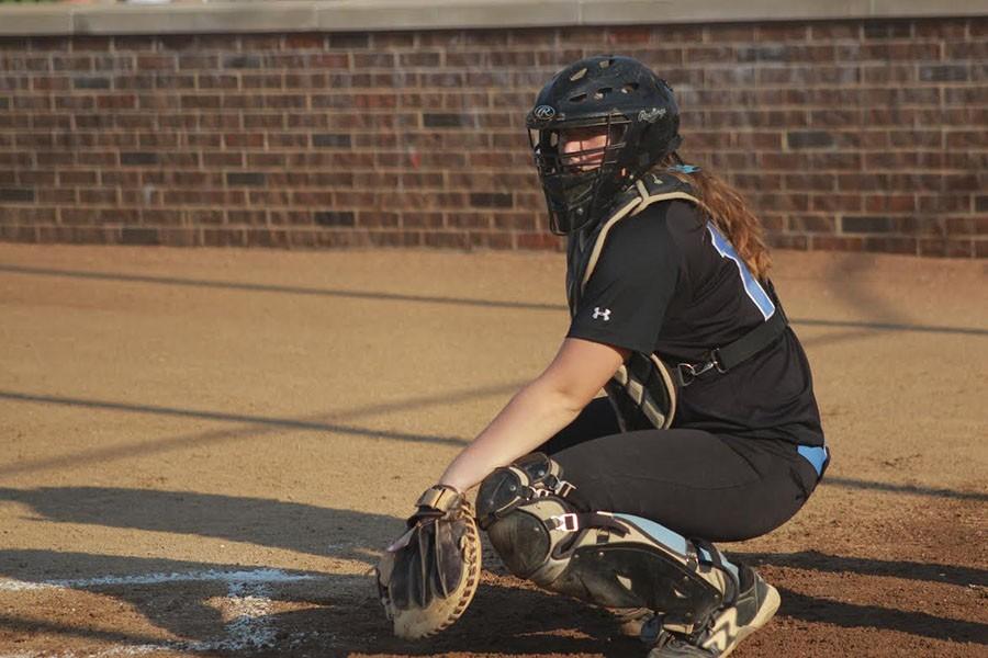 Junior Andrea Gordon plays catcher for the varsity girls softball team. The team was playing Webster Groves. I love being a part of every play and I like calling my own pitches. I like knowing that my coach trust me, Gordon said.