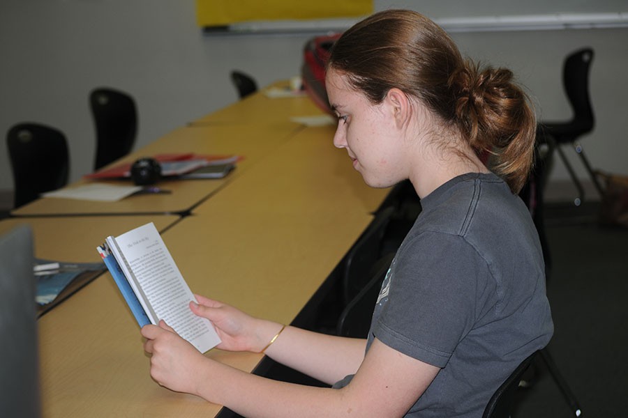 Freshman Sydney Kinzy reads her published story. "When I write, I always write something deep from inside me which is embedded in each and every character and conflict, and that's what I'm sharing. I'm sharing life's problems and how people deal with them. I'm sharing the truths of the world I see around me. Really, that's what writing is all about for me," Kinzy said.