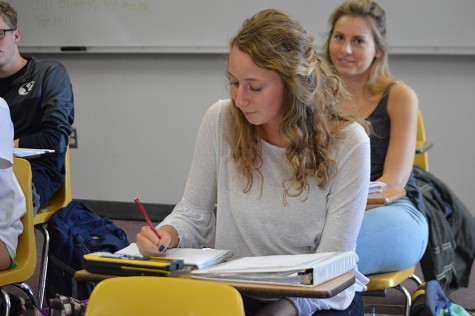 Completing an assignment, senior Jan Gagstetter studies in her AP Statistics class.