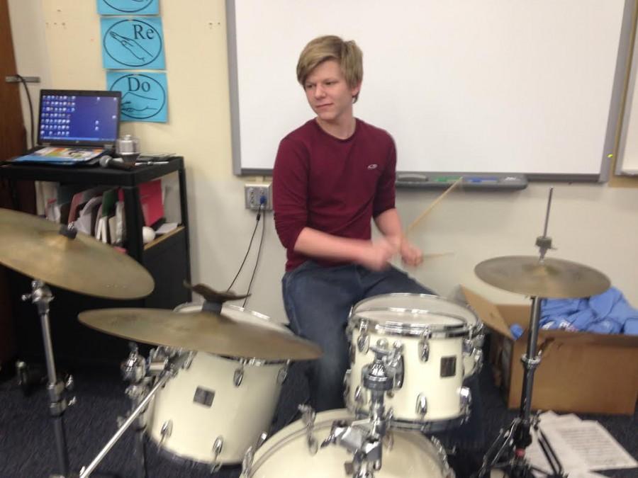 Junior+CJ+Schrieber+plays+the+drum+set+for+his+jazz+band%2C+Cosmic+Latte.+Schrieber+has+played+drum+set+in+West+High+marching+band+shows+since+his+freshman+year.+%E2%80%9CI%E2%80%99m+going+to+try+to+write+more+concert+band+things+that+are+less+percussion-oriented%2C%E2%80%9D+Schrieber+said+about+his+percussion-centered+compositions.