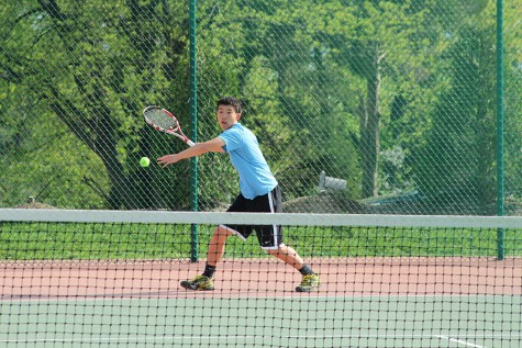 Returning the ball, senior William Tong competes in his match against Rockwood Summit last year.